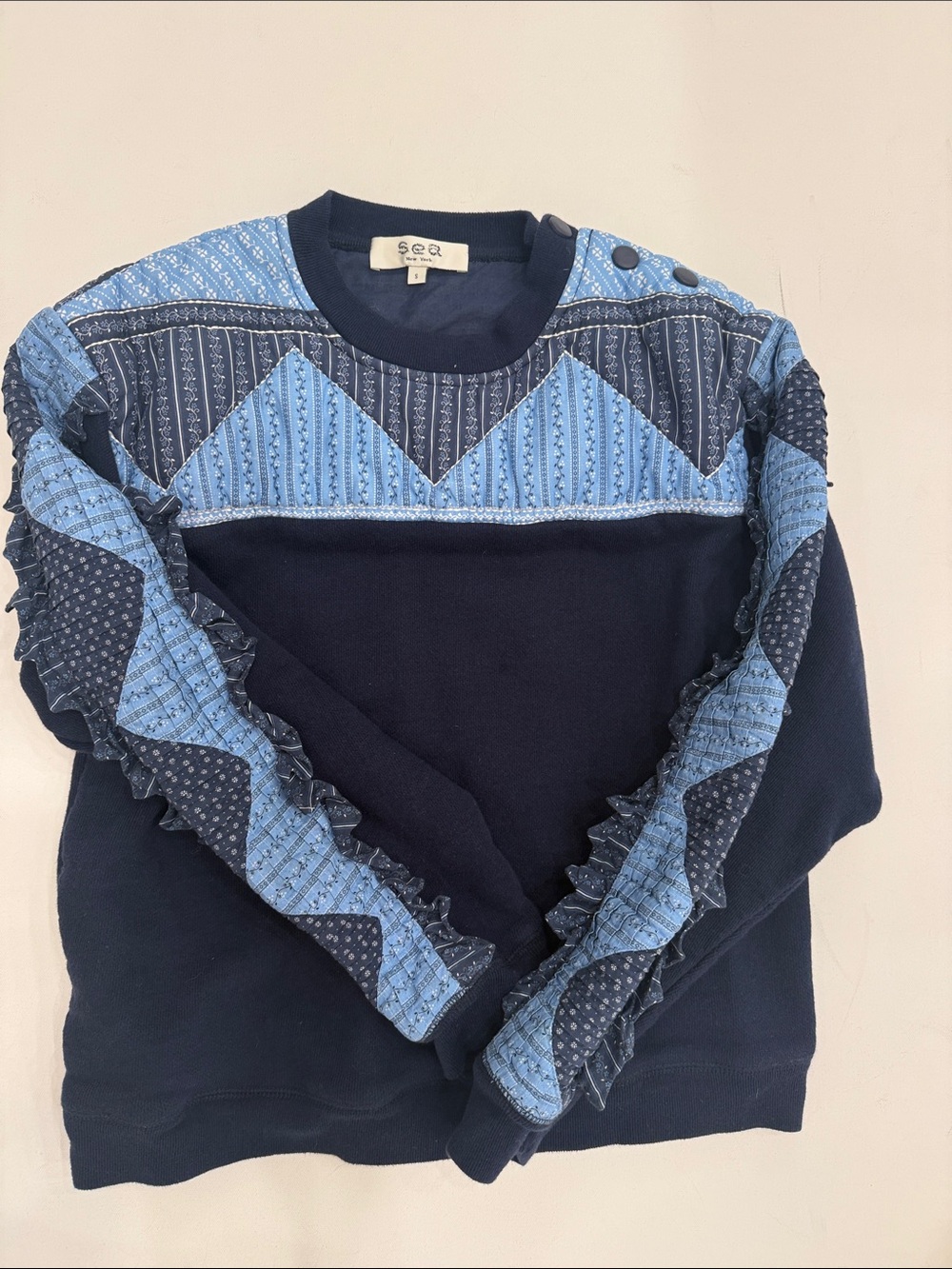 Sea Navy Sweater with Light Blue Quilted Panels and Ruffle Detail